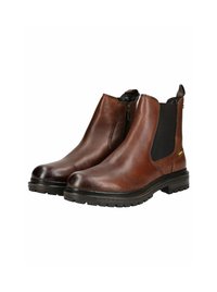 Botas Chelsea de cuero marrón con paneles laterales elásticos, punta redondeada y suela de goma texturizada, con un sutil detalle en dorado en el lateral.