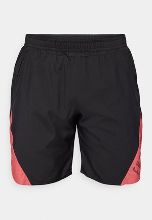 Black athletic shorts with elastic waistband and red panels on sides featuring partial black text design.