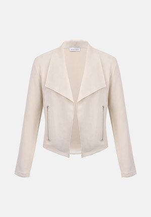 Damesjas in crèmekleur met brede revers, open voorkant, lange mouwen en twee verticale ritszakken aan de voorzijden.