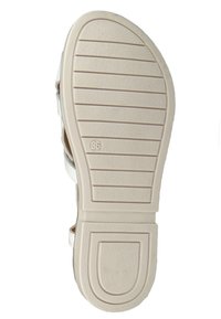 White sandal sole with ridged texture and slight arch; size marked as 36. The material is flexible with a smooth finish.