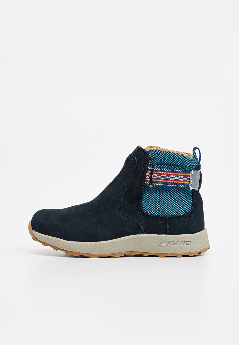 Dark blue suede ankle boot with a textured turquoise panel, featuring a decorative strap and beige rubber sole. Slightly rounded toe.
