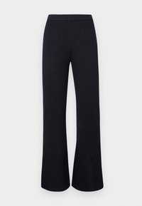 Fekete bordázott kötött, bőszárú nadrág elasztikus derékrésszel, fehér háttér előtt laposan kiterítve.