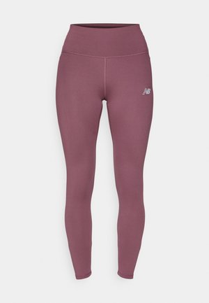 Purple leggings made of stretch material, featuring a high waistband and a small logo on the lower leg. Smooth texture and fitted design.