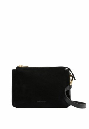 Black suede crossbody bag with gold zipper, leather strap, and embossed brand name. Rectangular shape with a smooth texture.