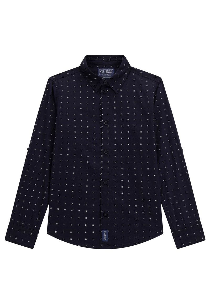 Marineblauw overhemd met knopen en een roosterpatroon van kleine witte vierkantjes. Het heeft een kraag, lange mouwen en een Guess-merklabel aan de zoom.