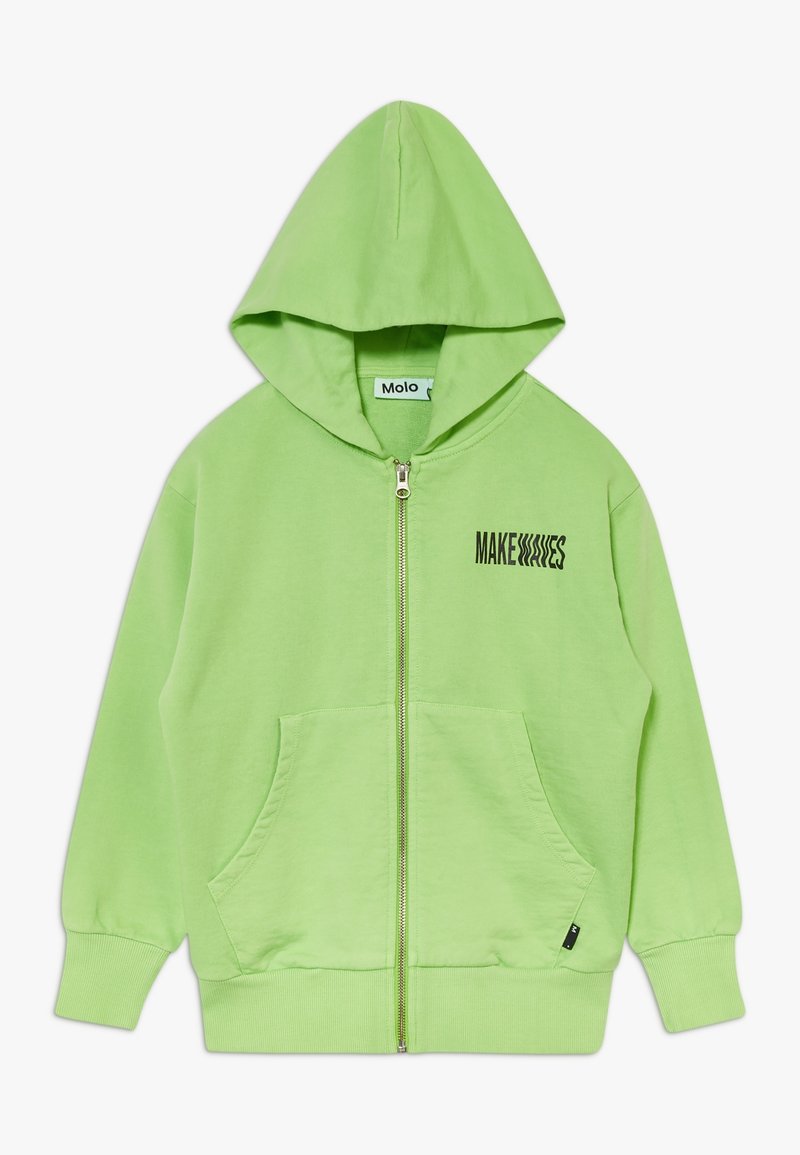 Sweat à capuche zippé vert clair avec poches avant, poignets côtelés, et texte "MAKE WAVES" sur la poitrine gauche en police noire déformée.