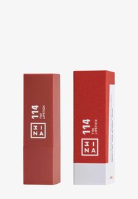 Red lipstick case and box. The case is matte with a square design, displaying the brand name and product number in white. Box has a glossy accent.