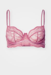 Lace bralette in muted pink with underwire support. Features adjustable straps and decorative scalloped edges. Translucent fabric detail.
