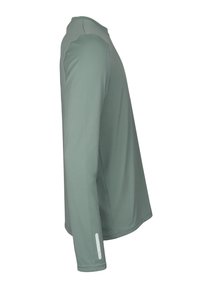 Långärmad skjorta i dämpad grön, tillverkad av ett mjukt tyg, med rund halsringning, kontrasterande axelsömmar och en reflexdetalj på ärmen.