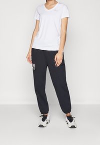Under Armour Jogginghose - black