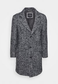 Cappotto con motivo a spina di pesce in bianco e nero, con colletto a revers, tre bottoni, due tasche frontali e maniche a tre quarti.