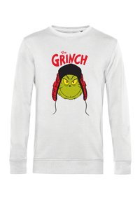 Felpa bianca con un grafico del Grinch verde, con un cappello nero e cuffie rosse. Il testo recita "IL GRINCH" in lettere rosse in grassetto.