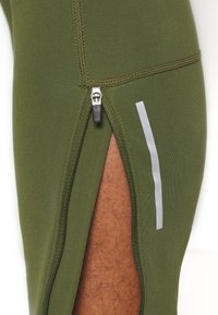 Nike Performance REPEL CHALLENGER - Calças de fato de treino - rough green/silver