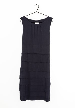 Sleeveless black knee-length dress with layered horizontal ruffles, hanging on a black hanger against a white background.