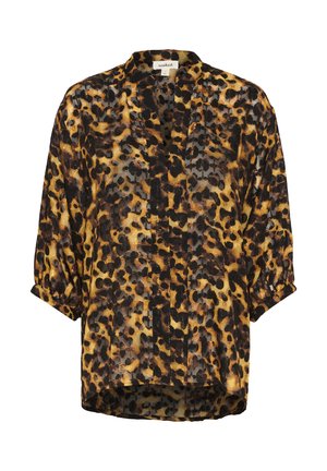 Lāču raksta blūze ar daļēji caurspīdīgu audumu, melnā un dzeltenā krāsā, garām piedurknēm un brīvu piegriezumu. Satur apkakles kakla izgriezumu un pogu priekšpusi.