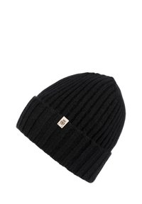 Black ribbed knit beanie hat with folded cuff and small beige tag featuring a crest logo on the front.