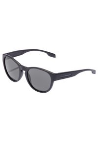 Ochelari de soare negri în stil cat-eye cu lentile nuanțate de gri, fabricați din plastic. Prezintă un design elegant și brațe texturate. Brandingul este vizibil pe ramă.