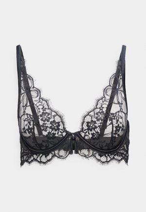 Soutien-gorge en dentelle noire avec motifs floraux, armatures, bretelles fines réglables, et fermeture frontale sur fond blanc.