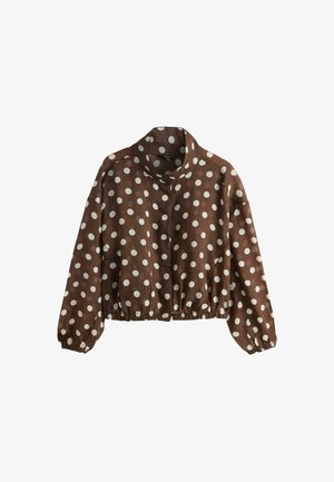 Braune Cropped-Jacke mit weißen Polka-Dots, hohem Kragen, langen Ärmeln, Knopfverschluss und elastischen Bündchen und Saum.