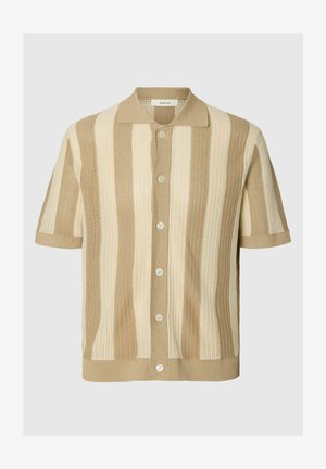 Lühikeste varrukatega beež ja kreemjas kootud kardigan vertikaalsete triipudega, esiküljel nööbitav ja terava kraega.