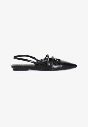 Black leather slingback flat shoes with a pointed toe, featuring two adjustable straps with square buckles and a textured surface.
