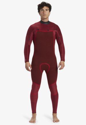 Red wetsuit with long sleeves and legs, featuring contrasting black accents, textured panels, and varied stitching patterns.