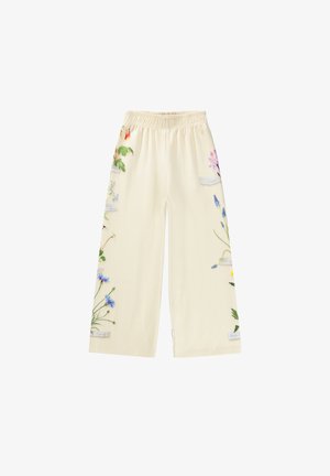 Kremfargede vide bukser med elastisk liv og botaniske blomstertrykk langs yttersidene av begge ben.