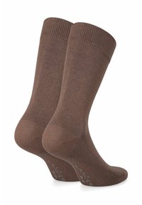 Brązowe bawełniane skarpetki z żebrowanymi mankietami, gładką teksturą oraz wzmocnionymi palcami i piętami. Nazwa marki nadrukowana po boku na biało.