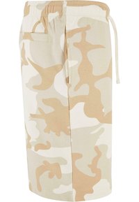 Beige camo shorts made of cotton blend fabric, featuring an elastic waistband with drawstring and a back pocket.