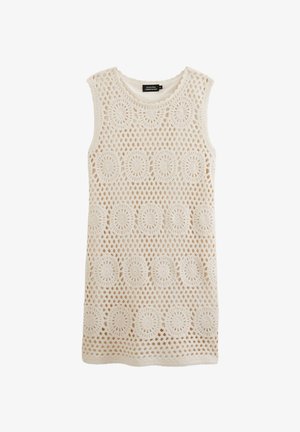 Robe sans manches au crochet couleur crème avec des motifs circulaires et un design en maille ouverte. Dotée d'un col rond et d'une texture douce.