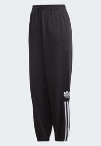 Svarta sweatsbyxor i mjukt material, med elastisk midja, sidfickor och vita tre-strimmiga detaljer längs benen.