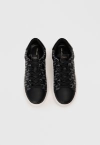 Black sneakers featuring a textured leather body, subtle patterned accents, round toe, and white rubber sole with black laces.