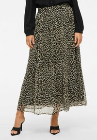 Jupe maxi imprimée léopard avec une silhouette fluide, fabriquée en tissu léger. Design plissé et taille large froncée.