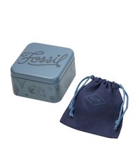 Square blue metal tin with black line drawings and "Fossil" lettering. Accompanied by a navy fabric pouch with a blue drawstring and the "Fossil" logo.