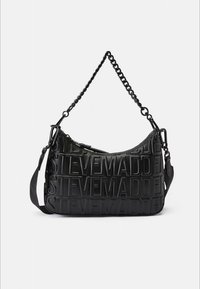 Black shoulder bag made of textured material with embossed "STEVE MADDEN" logo. Features a chain and adjustable strap. Curved design.
