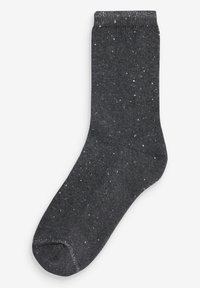 Chaussettes grises avec un motif moucheté en blanc et argent. Construites à partir d'un matériau doux et extensible avec un bord côtelé en haut.