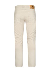 Jasnobeżowe spodnie o prostym kroju, wykonane z bawełny. Posiadają naszywkę z tyłu, dwie tylne kieszenie oraz subtelne przeszycia.