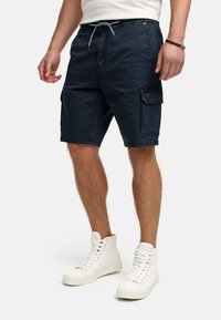 Mørkeblå cargoshorts lavet af slidstærkt stof, med elastisk talje med snøre og sidelommer.