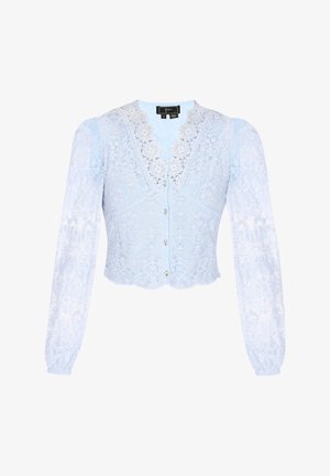 Hele sinine pitsbluus pikade, läikivate varrukatega, v-kaelusega pitsist äärisega, nööpidega kinnitamisega ja lainelise alläärega. Näha on keerulisi lillemustreid.