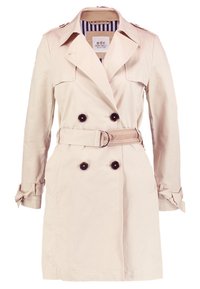 Beżowy płaszcz trench double-breasted z czarnymi guzikami, z paskiem w talii, w paski podszewka kołnierza oraz detalami w postaci klamer na mankietach. 