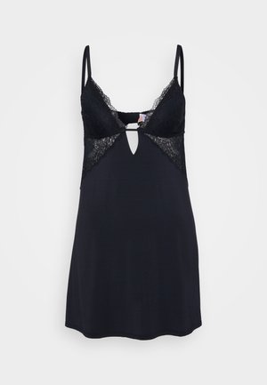 Lingerie noire avec des accents en dentelle sur les bonnets, des bretelles réglables et un détail en forme de clé à l'avant. Tissu doux, silhouette ajustée.