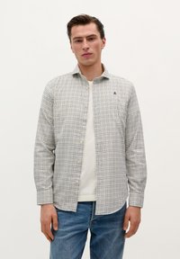 Button-up shirt in light fabric featuring a blue and white check pattern, with a classic collar and single chest logo. Worn with blue jeans.