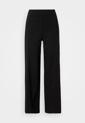 Black, wide-leg pants with an elastic waistband. Made from a smooth fabric, featuring a clean, minimalist design with no visible pockets.
