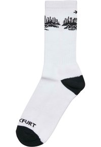 Weiße Socken mit schwarzen Akzenten, die ein Skyline-Design am oberen Rand aufweisen. Hergestellt aus weichem Material, mit verstärkter Ferse und Zehen.