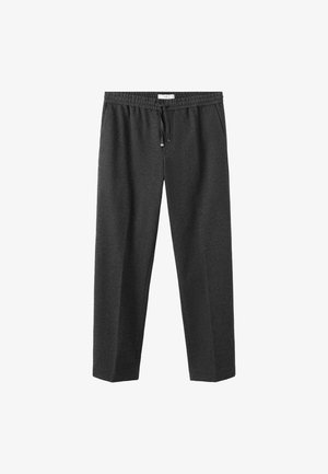 Sive, mehke trenirke iz blaga z elastičnim pasom in vrvico za zategovanje. Ohlapen kroj, dolžina do tal, brez vidnih vzorcev ali poudarkov.