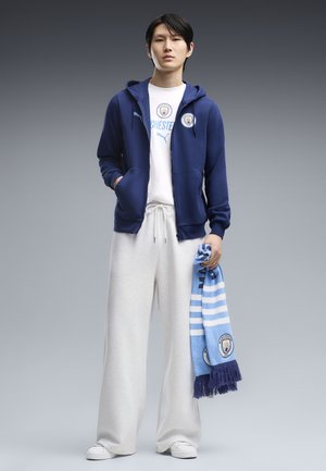 Puma, MANCHESTER CITY FTBLCULTURE KAPUZENJACKE - Sweatjakke - blue jewel-team light blue