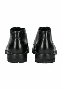 Botas de tobillo de cuero negro con un acabado suave, punta redonda y tacón bajo apilado. Presenta costuras minimalistas y una suela texturada.