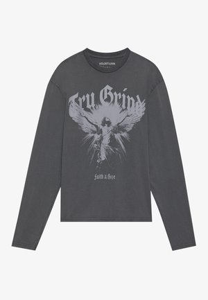 Long-sleeve graphic t-shirt in dark gray, featuring a central silver design of an angel, with "Try Grind" and "Faith & Hope" text.