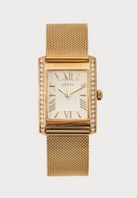 Gouden horloge met meshband, rechthoekige kast, witte wijzerplaat, Romeinse cijfers en kristalaccenten op de lunette. Merklogo zichtbaar.