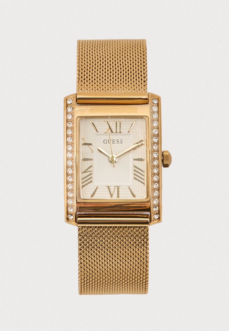 Gouden horloge met meshband, rechthoekige kast, witte wijzerplaat, Romeinse cijfers en kristalaccenten op de lunette. Merklogo zichtbaar.